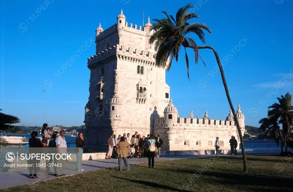 Palm tree in front of lighthouse, Belem Tower, Belem, Lisbon, Portugal