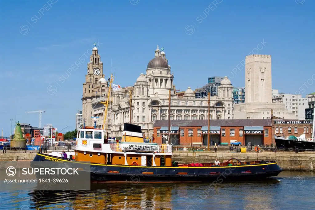 Boat at harbor with buildings in background, Cunard Building, Royal Liver Building, Port Of Liverpool Building, River Mersey, Liverpool, Merseyside, N...