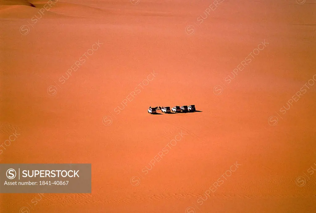 Aerial view of jeeps in desert, Tadrart Acacus, Fezzan, Libya
