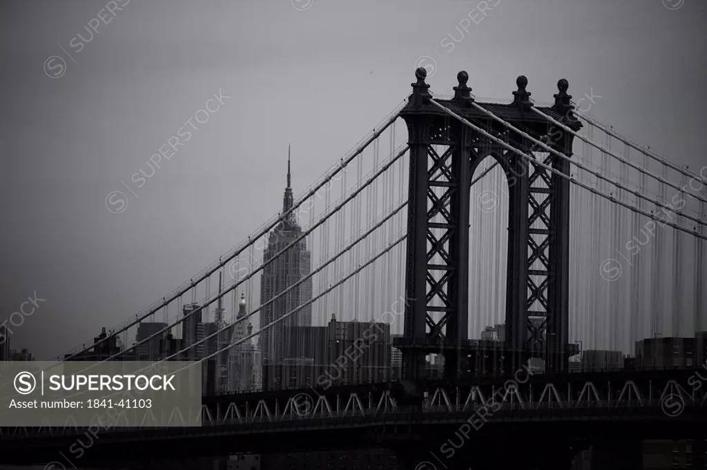 The Manhattan Bridge with the Empire State Building in the background, New York City, USA