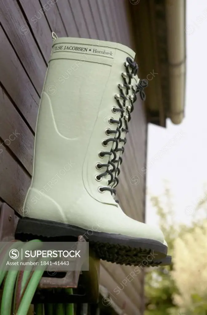 Close_up of gumboot outside house
