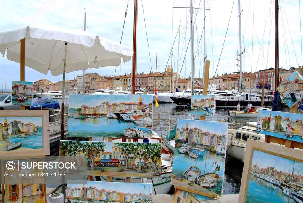 Display of paintings at the harbour of St. Tropez, France