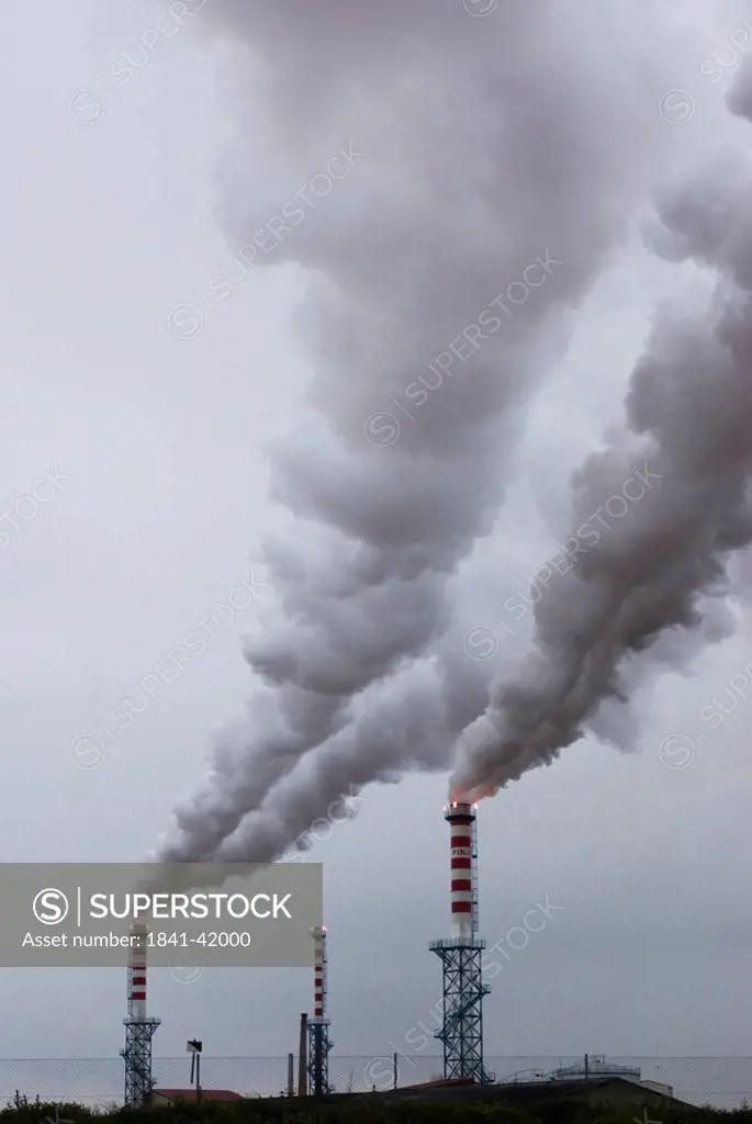 Smoke emitting from chimneys of chemical plant, Madrid, Castilla La Mancha, Spain