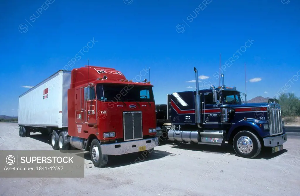 Two trucks parked at roadside, USA