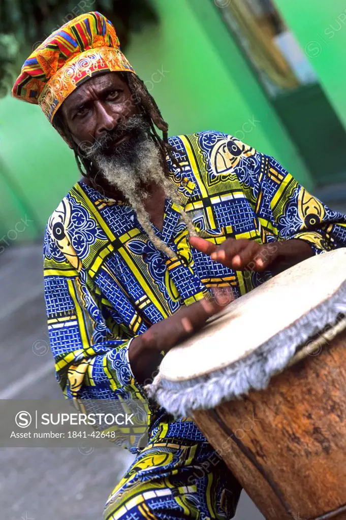 Portrait of man playing drum, Antigua, Lesser Antilles, Leeward Islands, Antigua and Barbuda