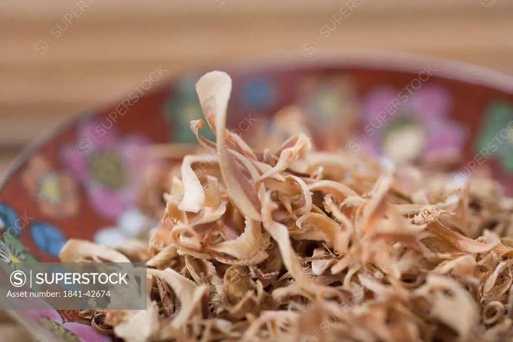 Close_up of dried ginger slices in bowl