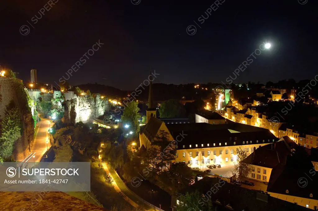 Aerial view of city lit up at night, River Alzette, Luxembourg City, Luxembourg