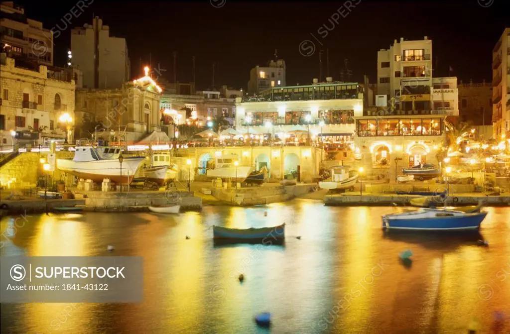 Restaurants lit up at night, St Julians Island, Malta