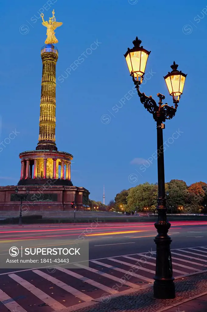 Lit up lamp post in front of monument, Berlin Victory Column, Berlin, Germany