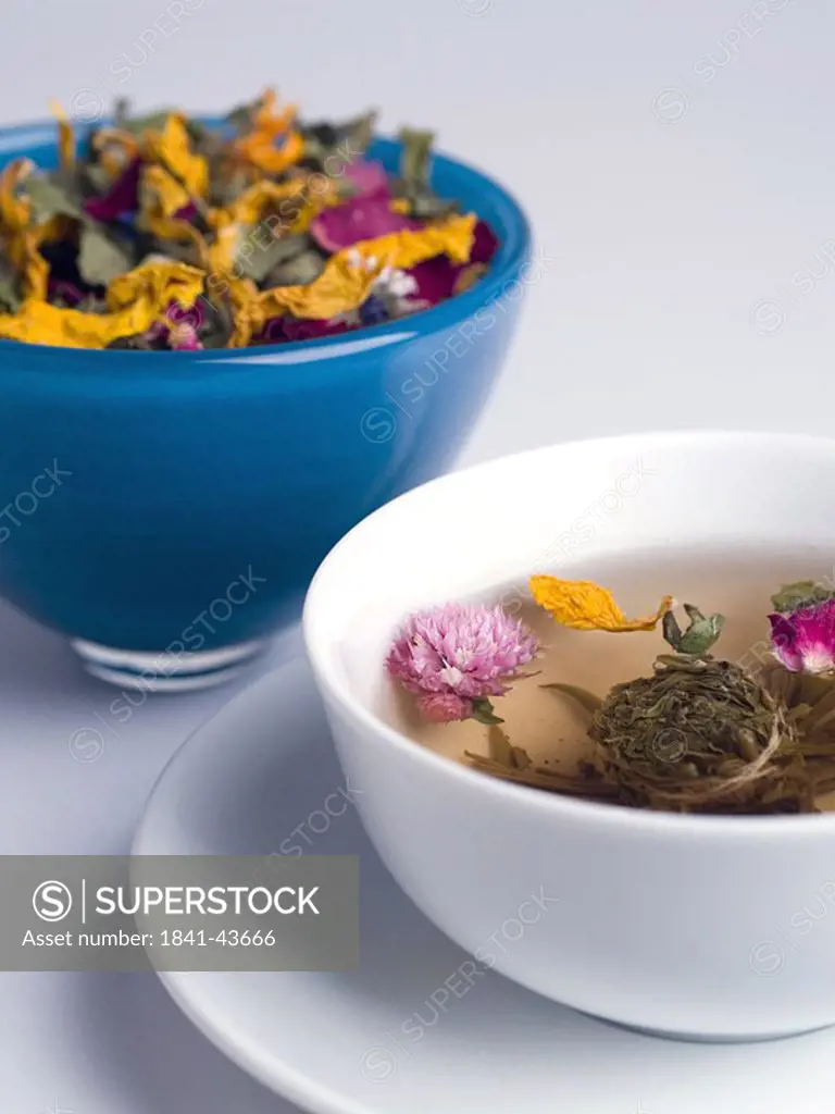 Flowers and herbs floating in bowl
