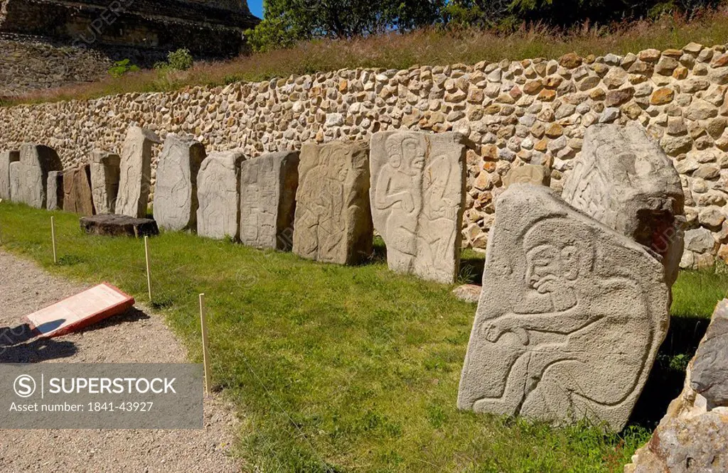 Bass reliefs engraved on stones, Los Danzantes, Monte Alban, Oaxaca, Mexico