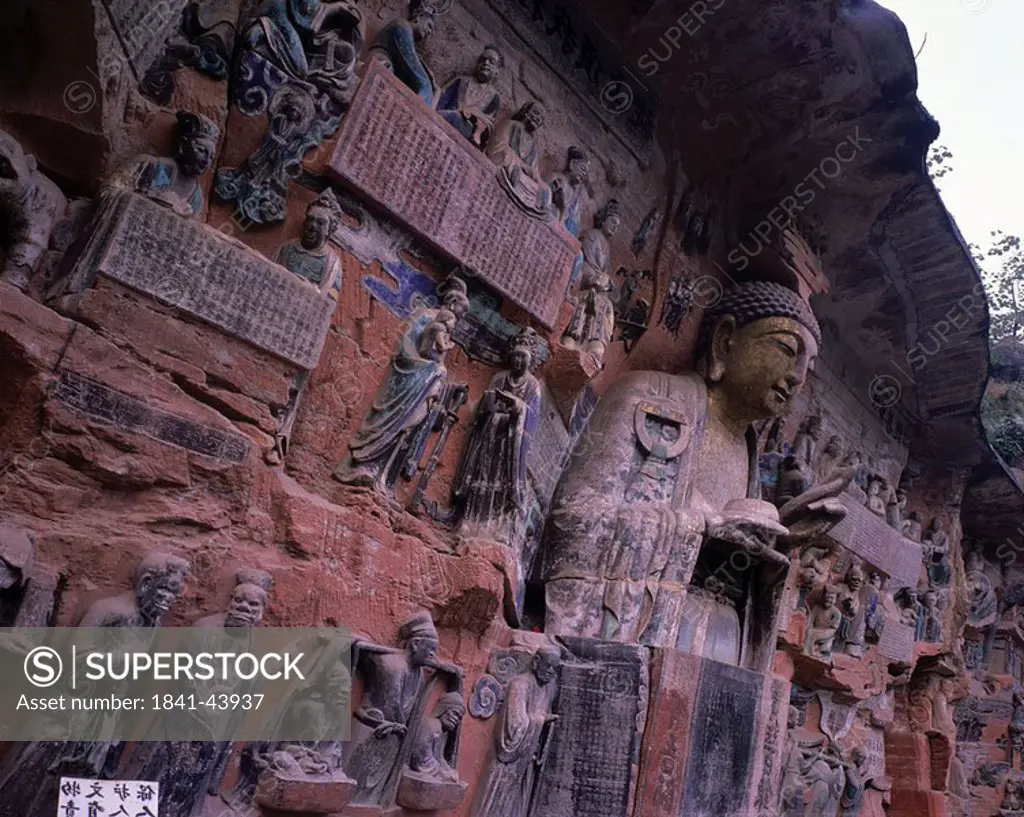 Sculptures caved on rock face, Dazu Grottoes, Chongqing, China