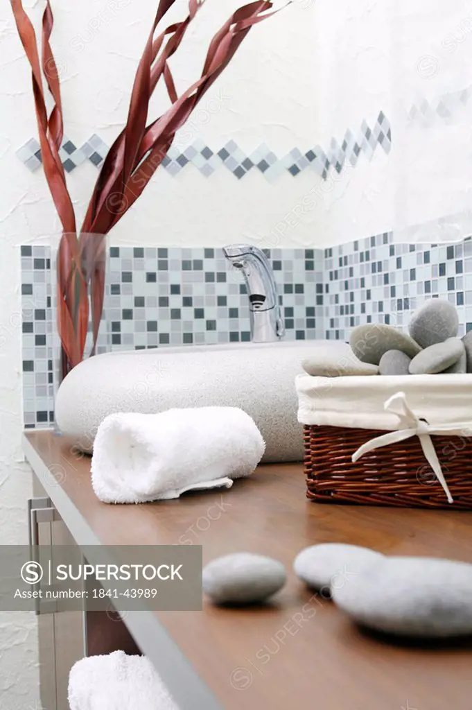 Pebbles and towel on shelf