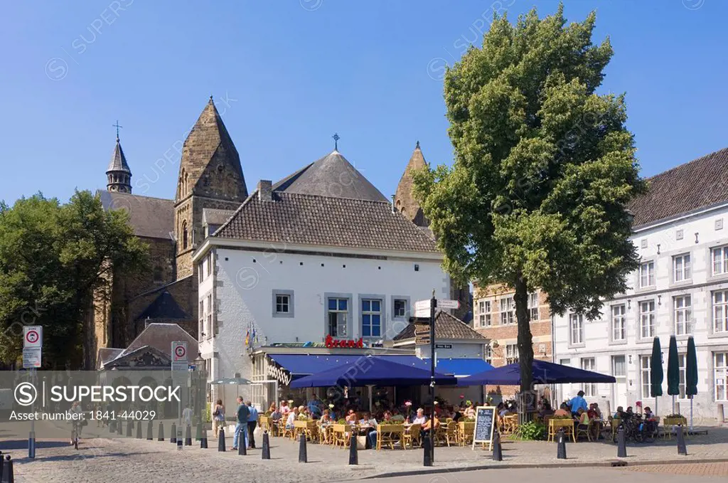 Tourists sitting at sidewalk cafe, Maastricht, Limburg, Netherlands