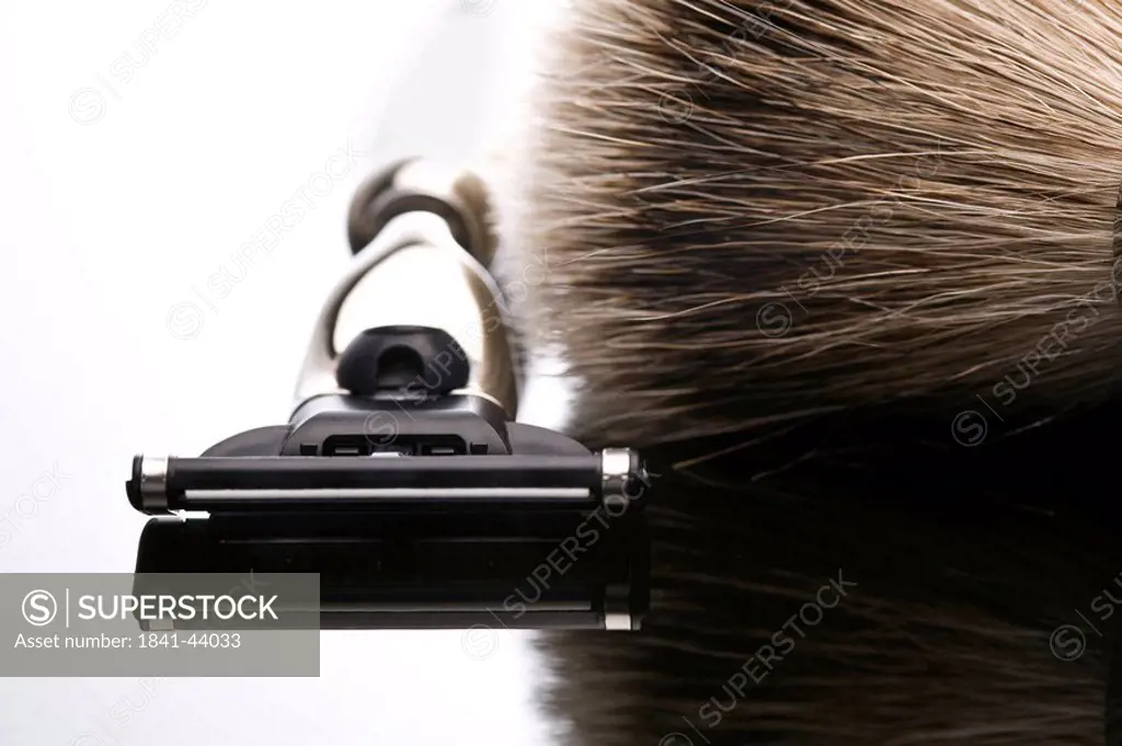 Close_up of shaving brush and razor