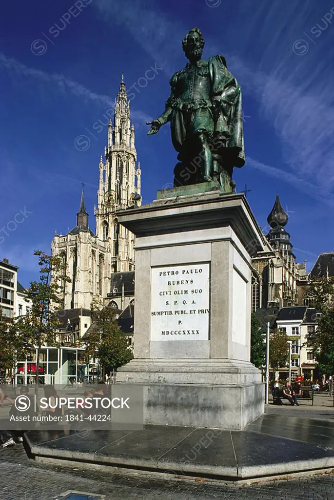 Tourists sitting near sculpture, Antwerp, Belgium