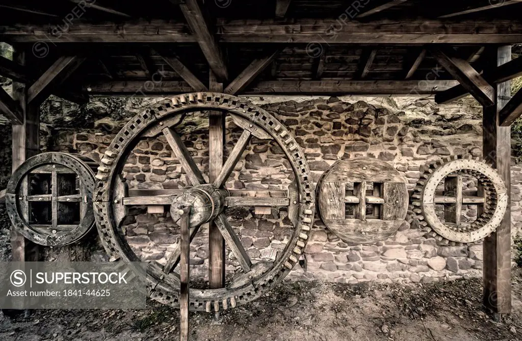 Gear wheel on wall of castle, Dreieichenhain Castle, Dreieich, Darmstadt, Hesse, Germany