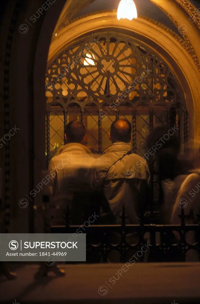 People praying in a church, Basilica of Saint Clare, Assisi, Perugia Province, Umbria, Italy