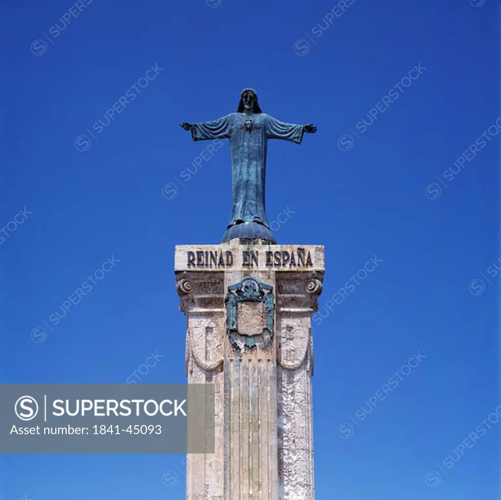 Sculpture on column against blue sky, Menorca, Balearic Islands, Spain