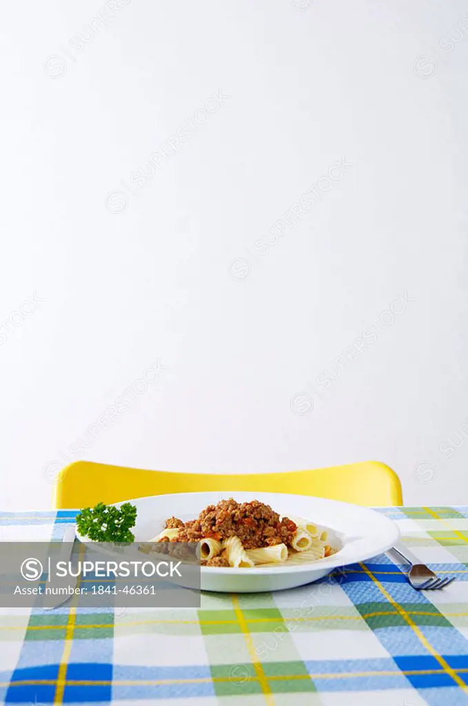 Pasta with sauce and parsley on plate