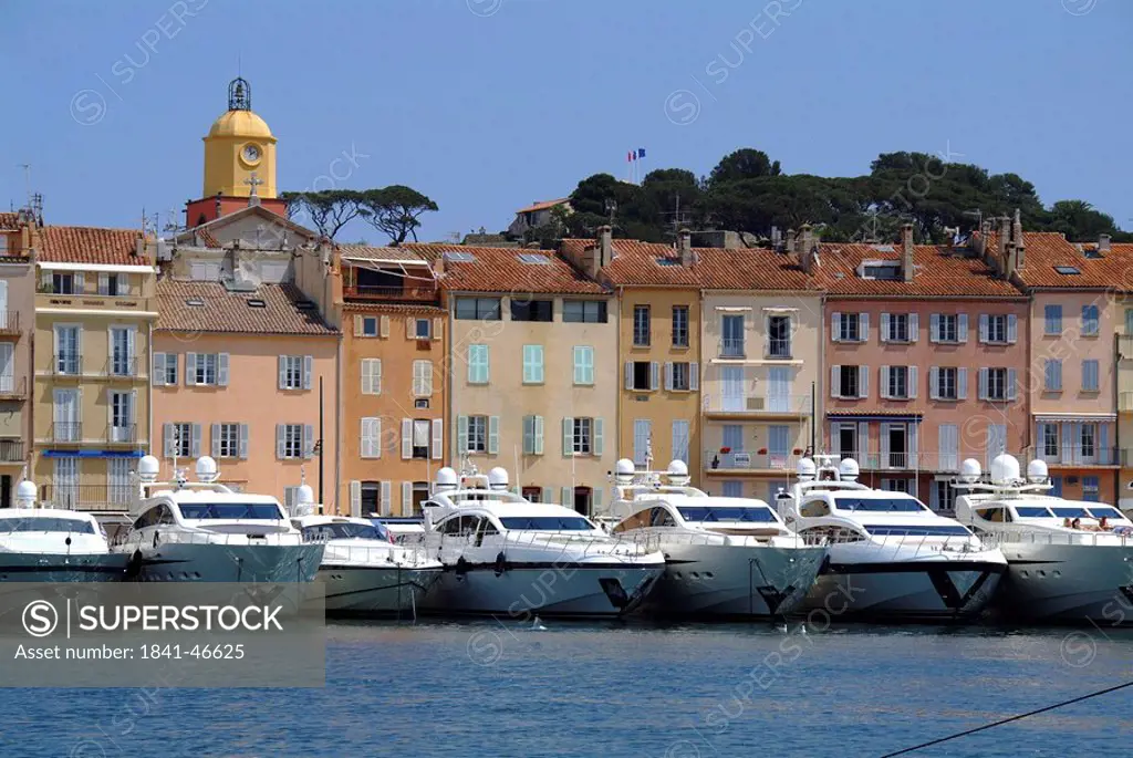 Yachts in a row at the harbour of St. Tropez, France