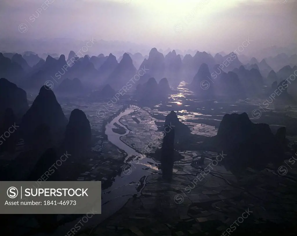 Aerial view of river flowing through landscape, China