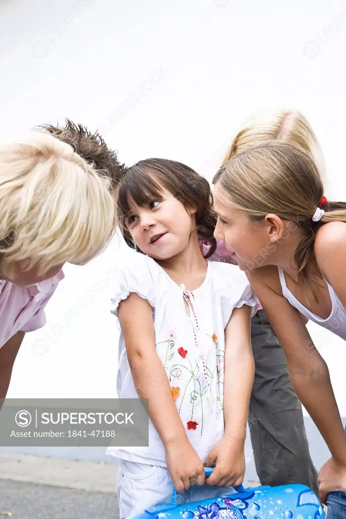 Children listening to a little girl