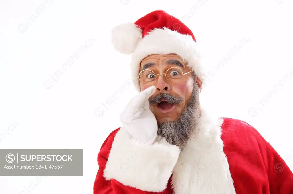Portrait of senior man in santa costume whispering