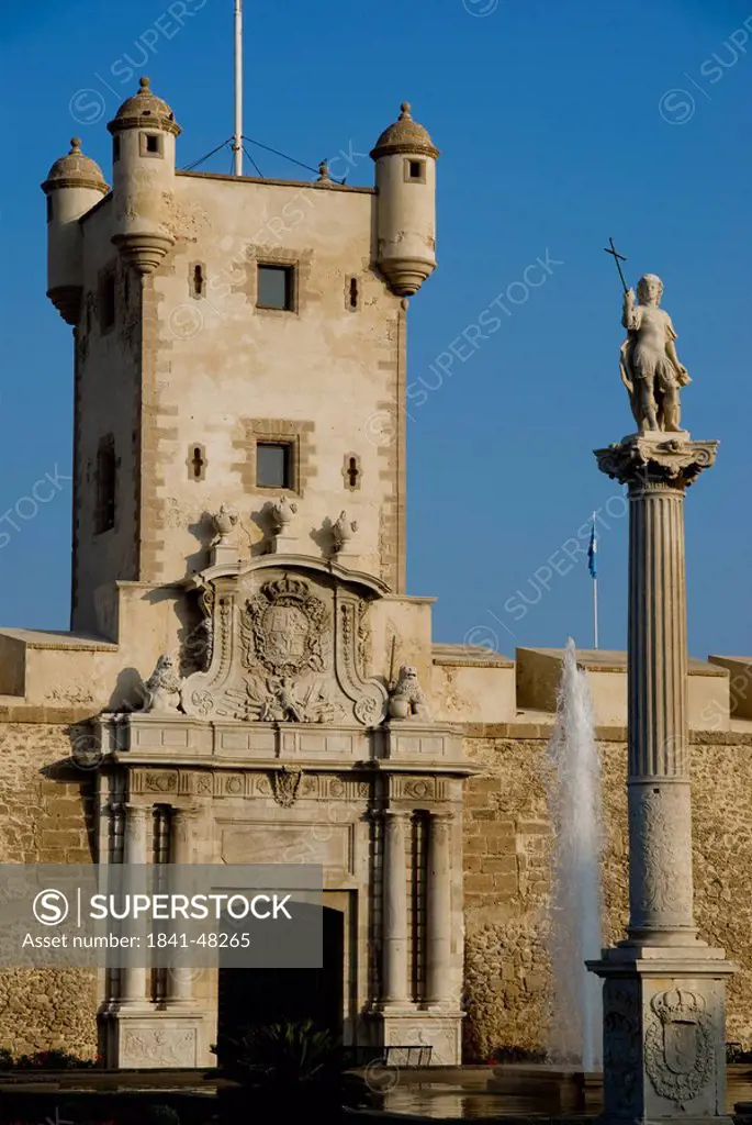 Obelisk and fountain in front of tower building, Costa de la Luz, Puertas de Tierra, Cadiz, Andalusia, Spain