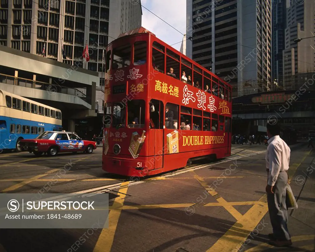 Tourists in double decker bus in city, Hong Kong