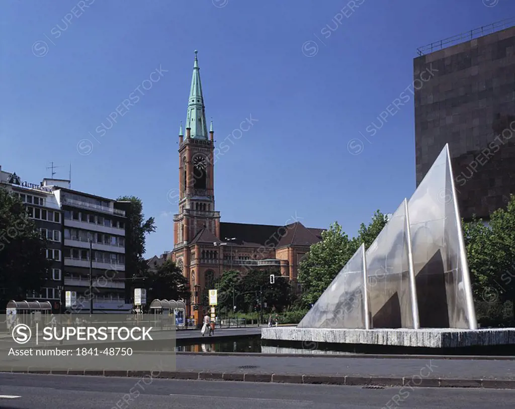 People near fountain in city, Dusseldorf, Germany