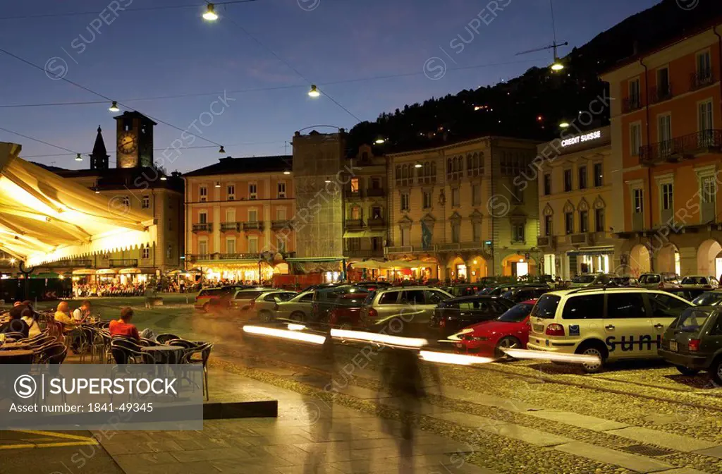 Cars parked in front of sidewalk cafe, Piazza Grande, Locarno, Switzerland