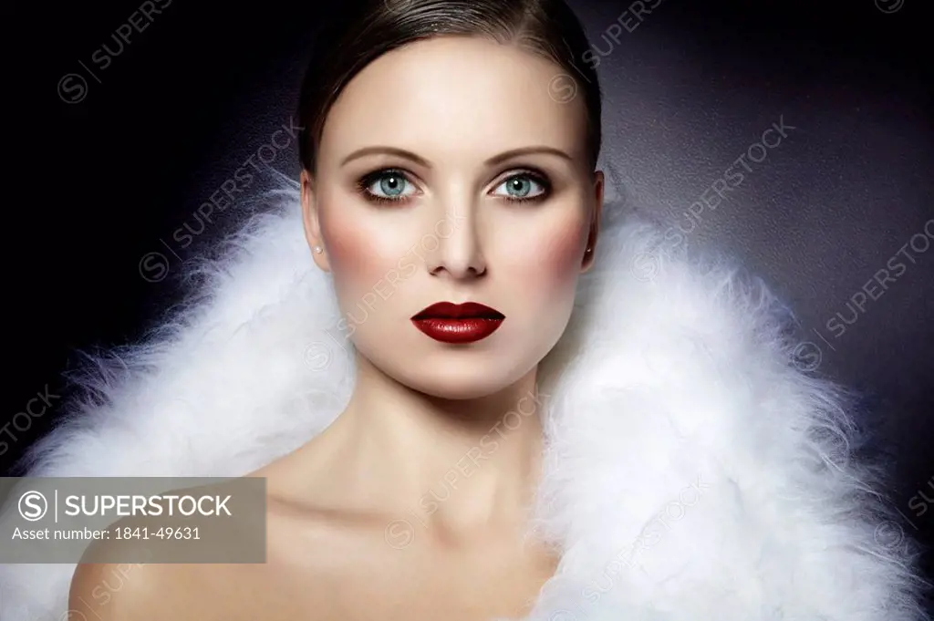 Young woman in white fur, portrait