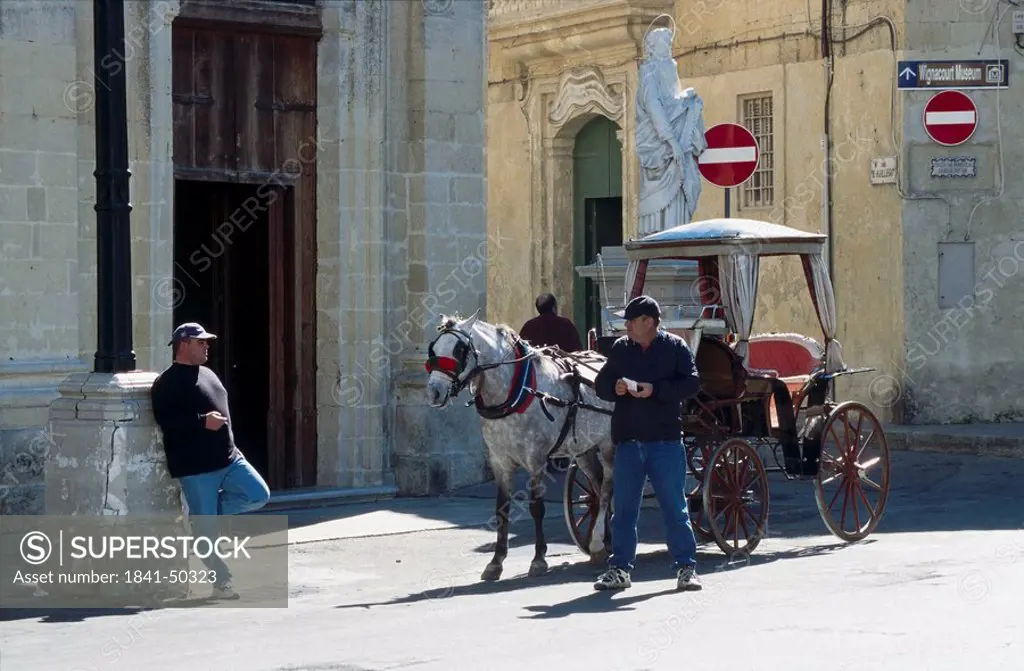 Two coachmen waiting near carriage, Rabat, Malta