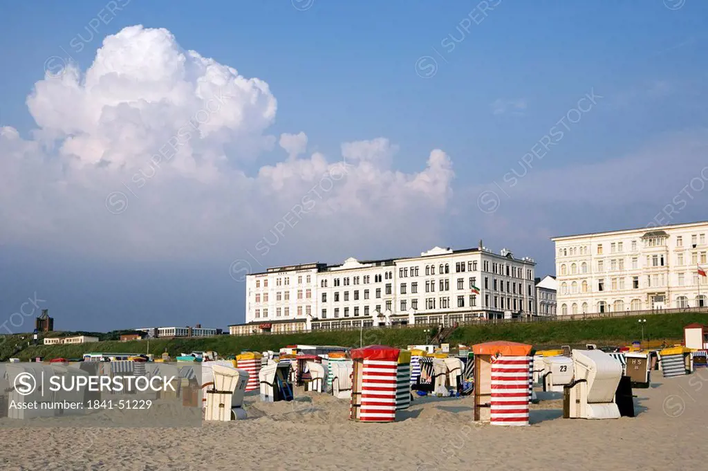 Hooded beach chairs on beach, Borkum, Lower Saxony, Germany