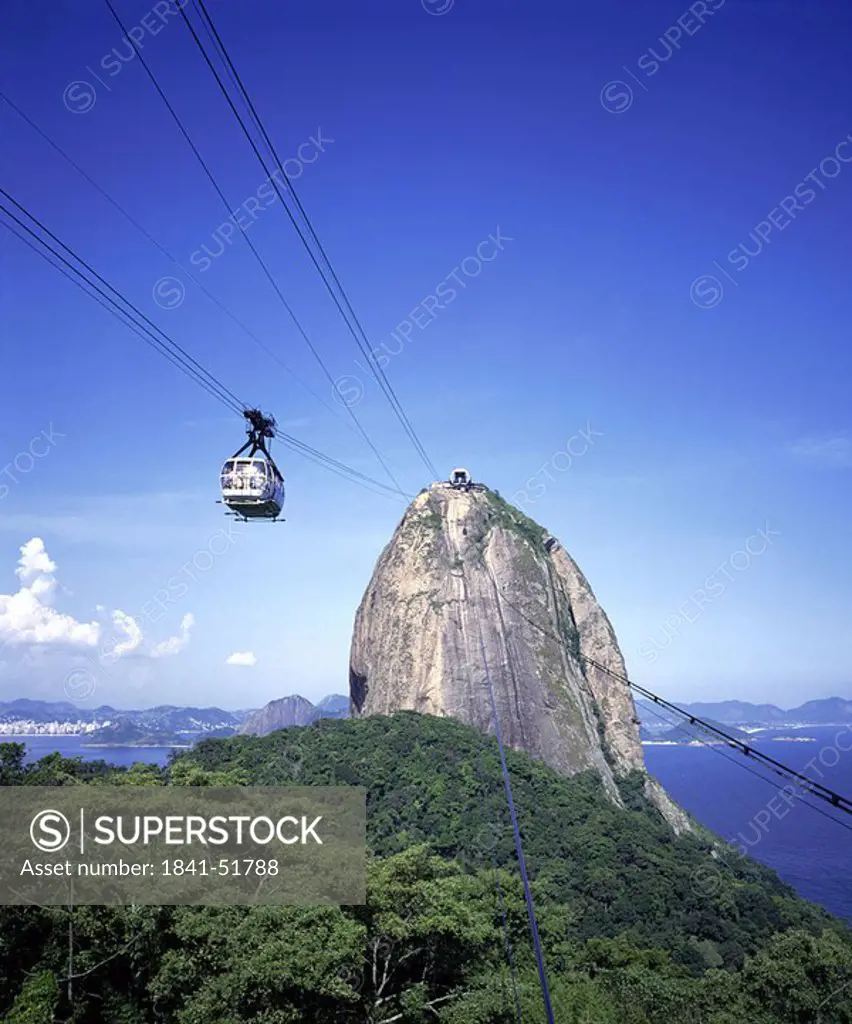 Cable car moving from cliff on cable, Brazil