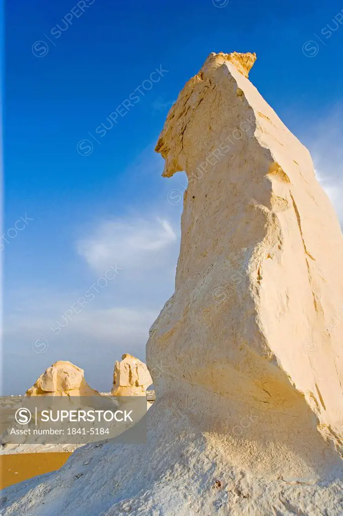 Low angle view of rock formations in arid landscape, Farafra Oasis, Libyan Desert, Egypt