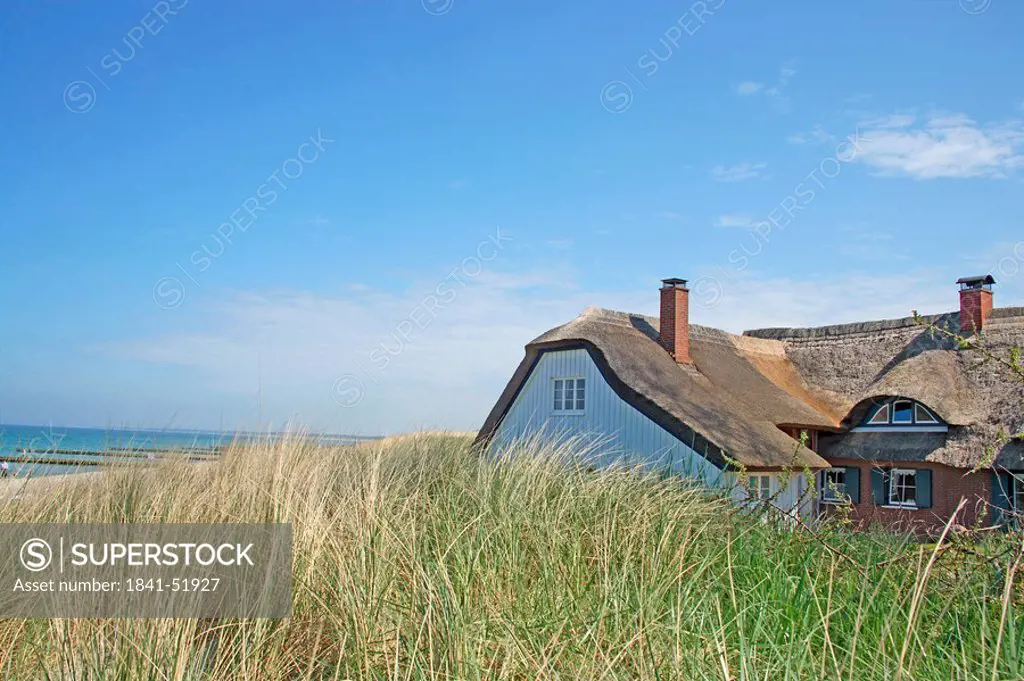 Thatched house amidst the dunes of Darss, Germany