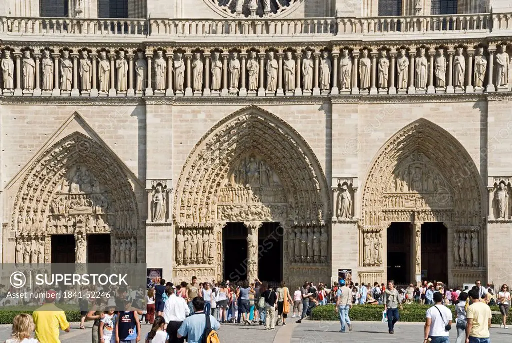 Tourists in front of cathedral, Notre Dame Cathedral, Paris, France.