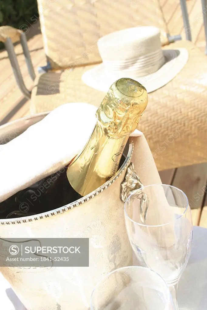 High angle view of Champagne bottle in ice bucket