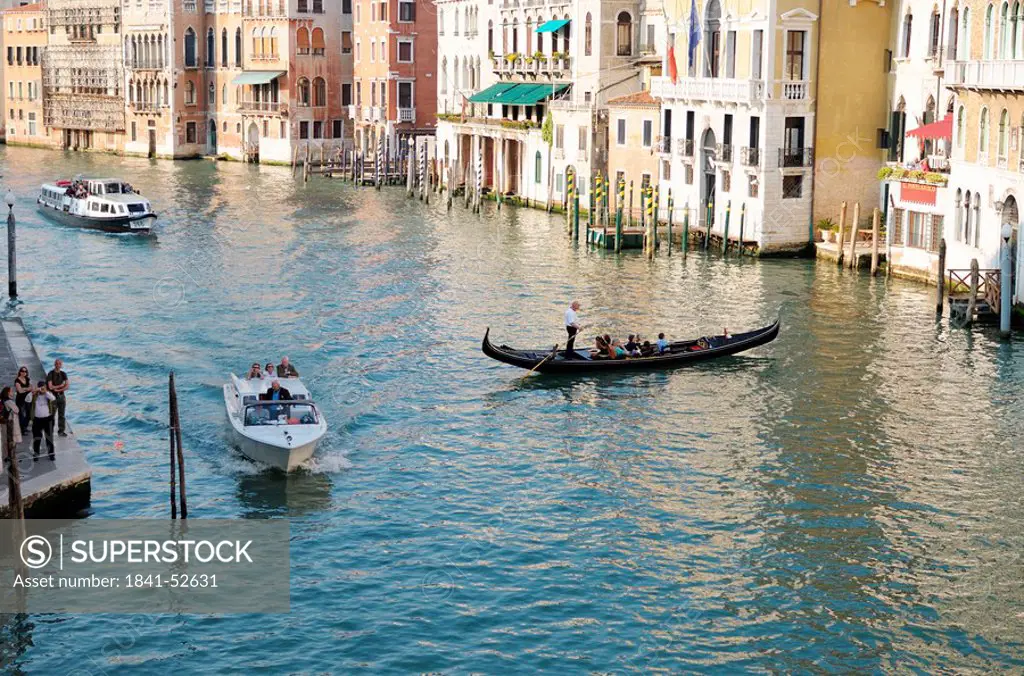 Gondola and boats on a canal, Venice, Italy, high angle view