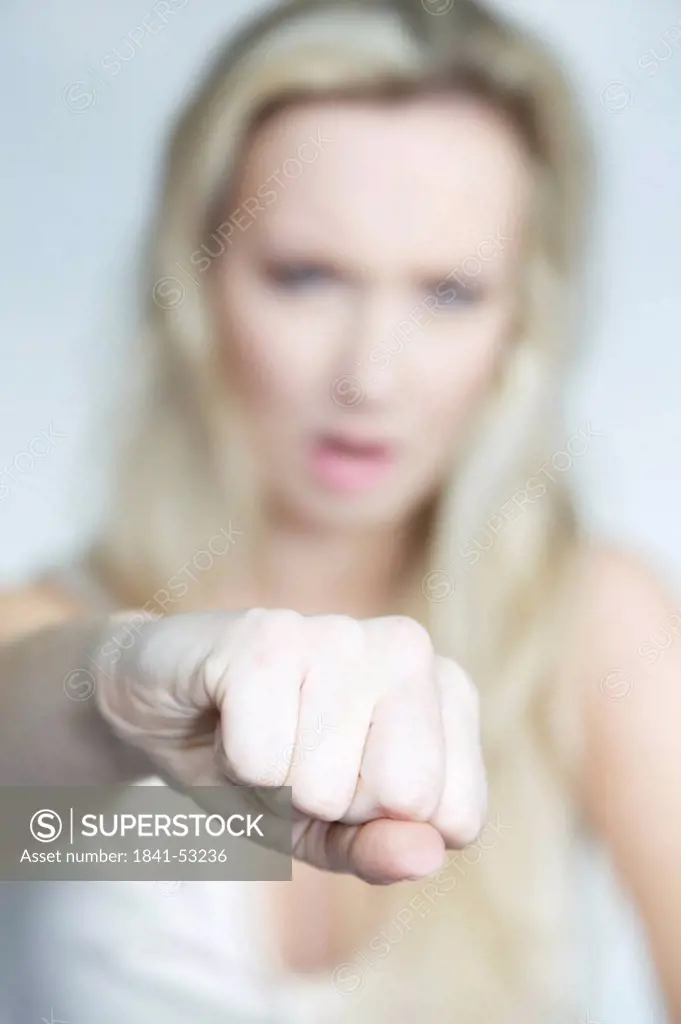 Woman punching at camera