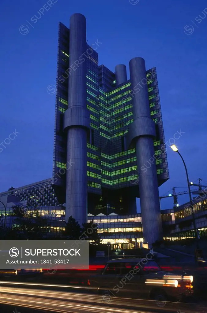 Low angle view of bank lit up at night, Hypovereinsbank, Munich, Bavaria, Germany