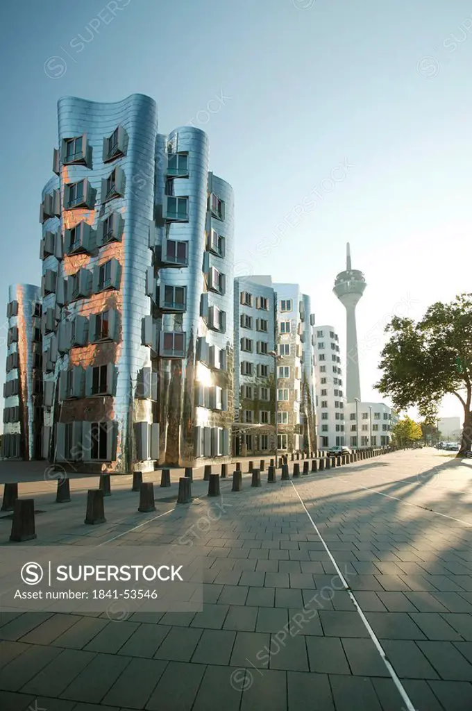 Communication tower and buildings in city, Rhein Tower, Gehry Buildings, Dusseldorf, North Rhine_Westphalia, Germany