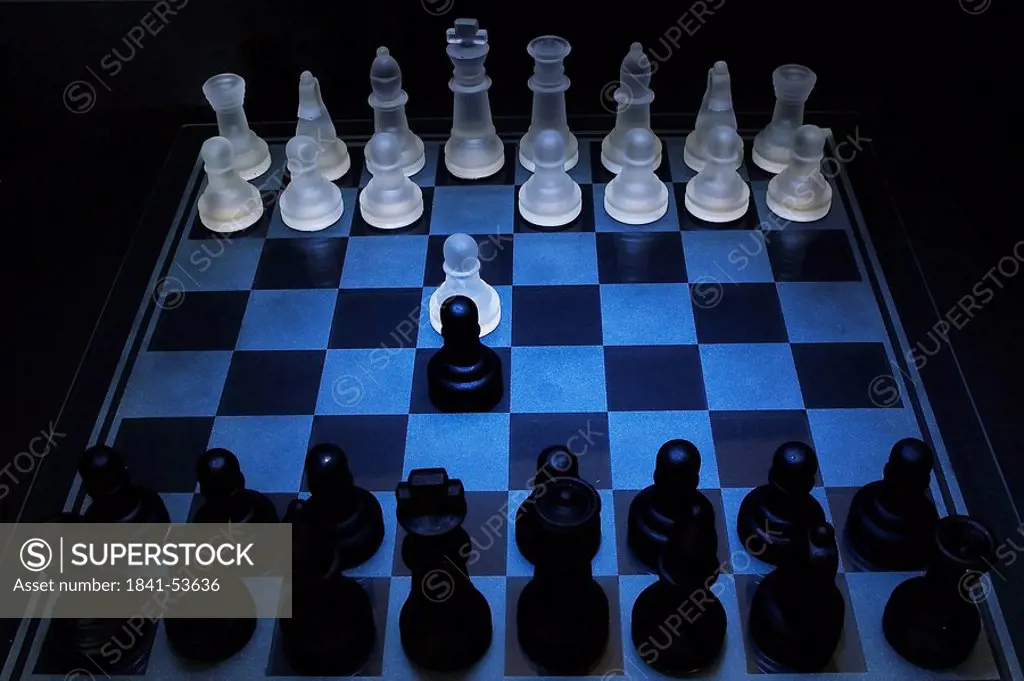 High angle view of chess pieces on chessboard