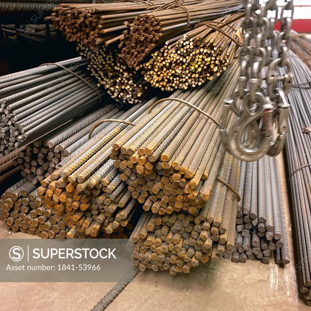 Bundle of metal rods with hanging chains