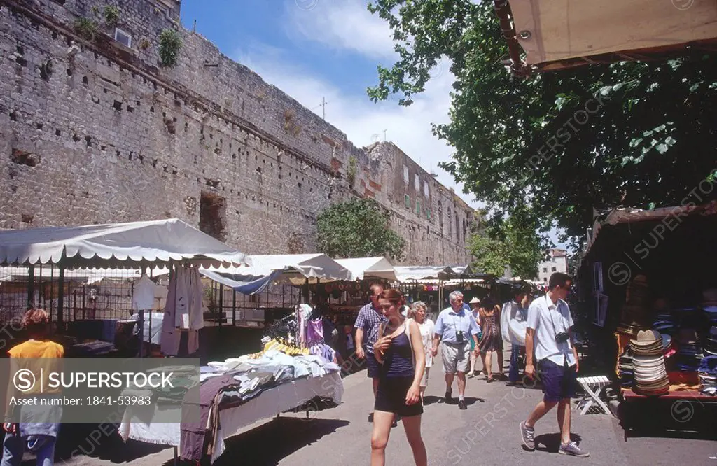 People walking in market near city walls, Diocletian´s Palace, Split, Croatia