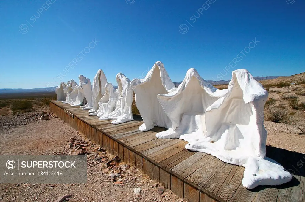 Sculptures of ghost on landscape, Goldwell Open Air Museum, Rhyolite, Nevada, USA