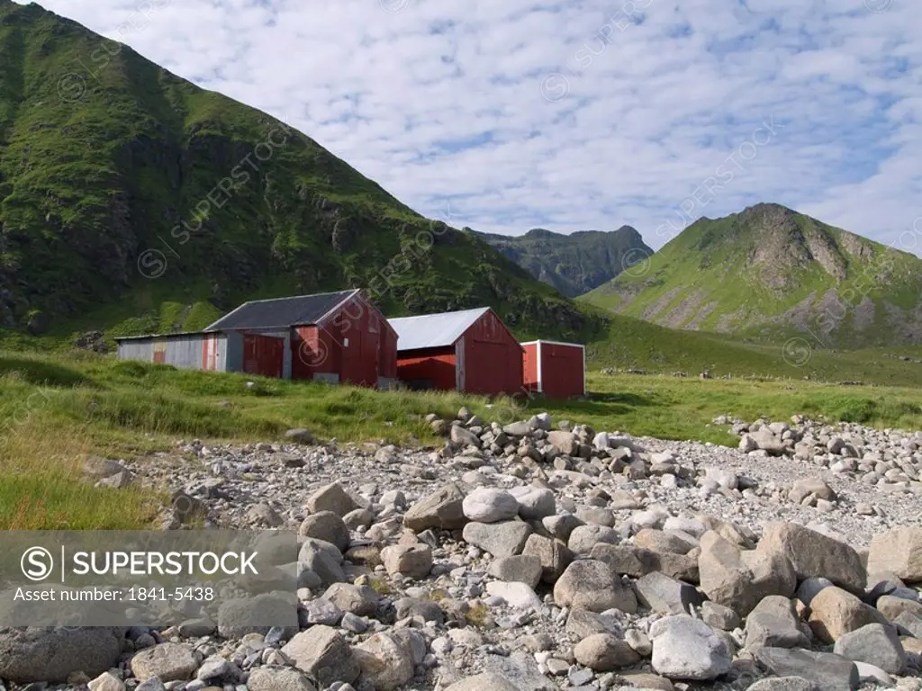 Stones in front of fishing huts on coast, Eggum, Vestvagoy Municipality, Lofoten, Nordland County, Norway