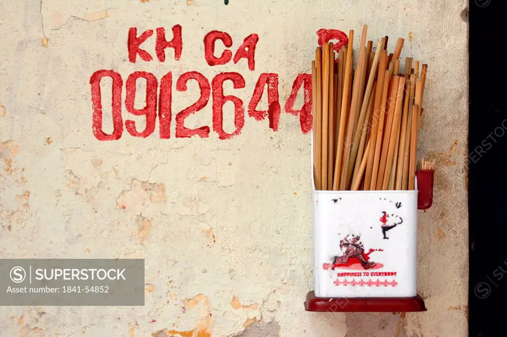 Close_up of chopsticks and toothpicks in container, Hanoi, Vietnam, Asia